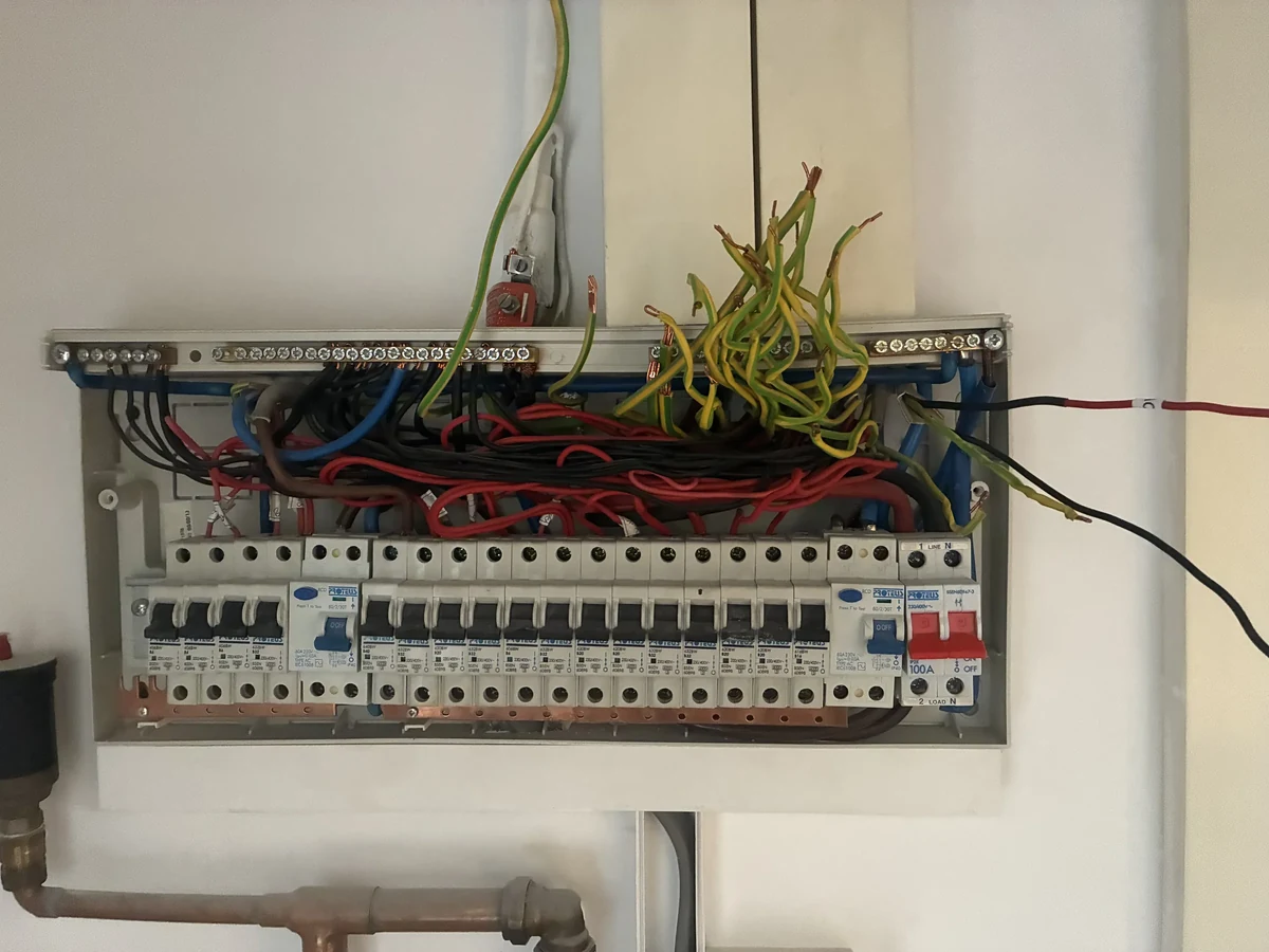 Messy consumer unit wiring before the upgrade